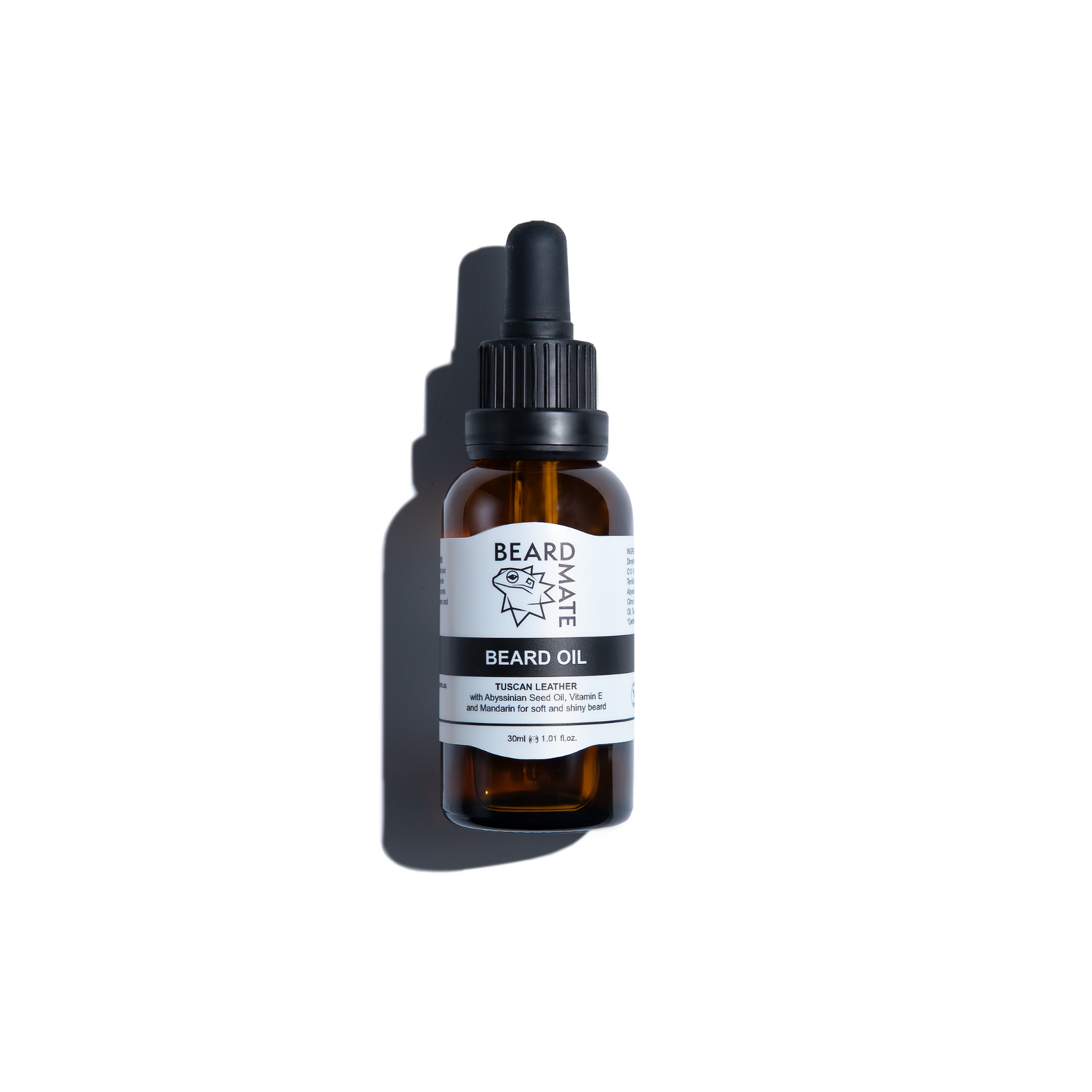 Brown glass bottle with beard oil and with black dropper labeled 'BEARDMATE' 