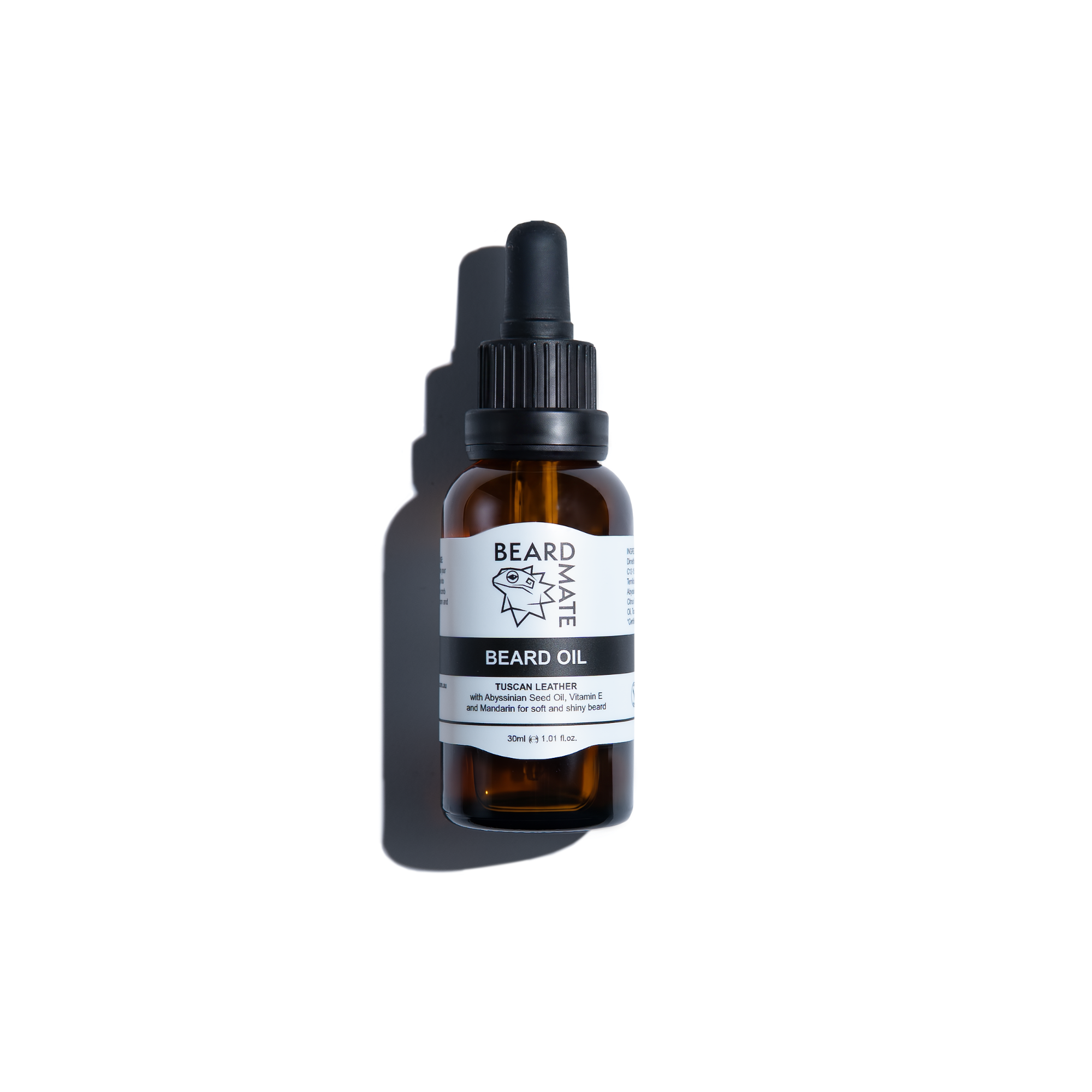 Brown glass bottle with beard oil and with black dropper labeled 'BEARDMATE' 