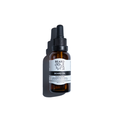 Brown glass bottle with beard oil and with black dropper labeled 'BEARDMATE' 