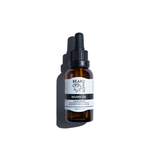 Brown glass bottle with beard oil and with black dropper labeled 'BEARDMATE' 