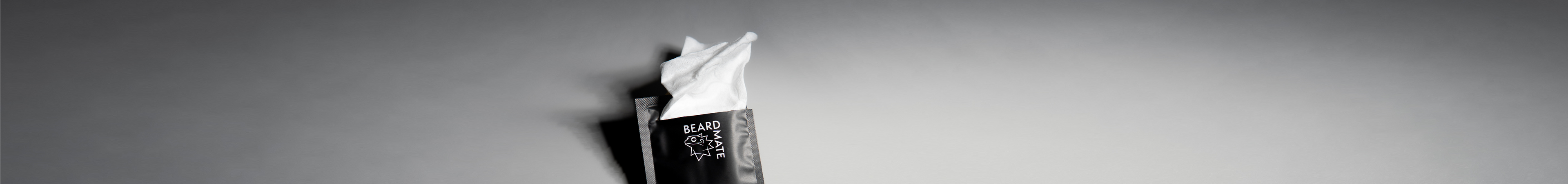 Black beardmate cleansing wipe on a gray background