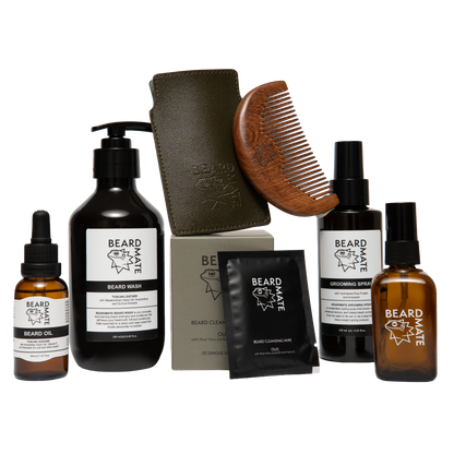 Collection of beard care products including bottles, a scrub, and a comb on a white background