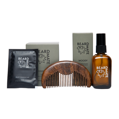 Beard care products including a bottle, comb, and packets on a white background