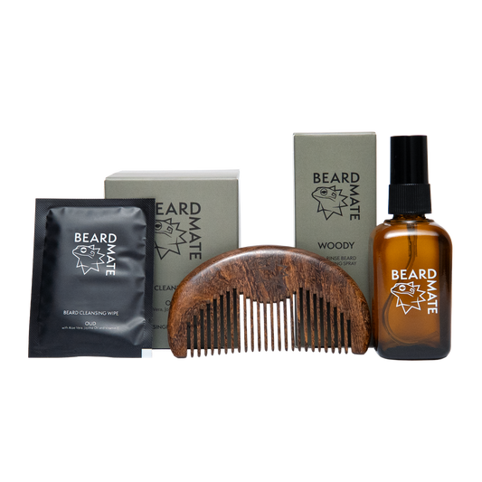 Beard care products including a bottle, comb, and packets on a white background